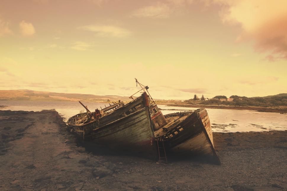 Free Image of Boat Resting on Sandy Beach 