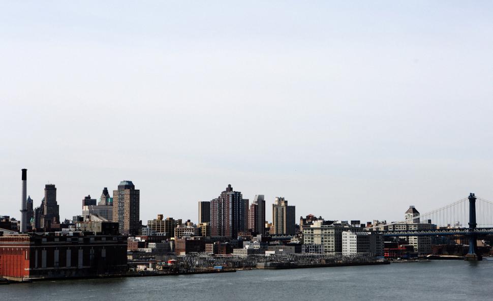 Free Image of Urban Cityscape Across Vast Waterbody 