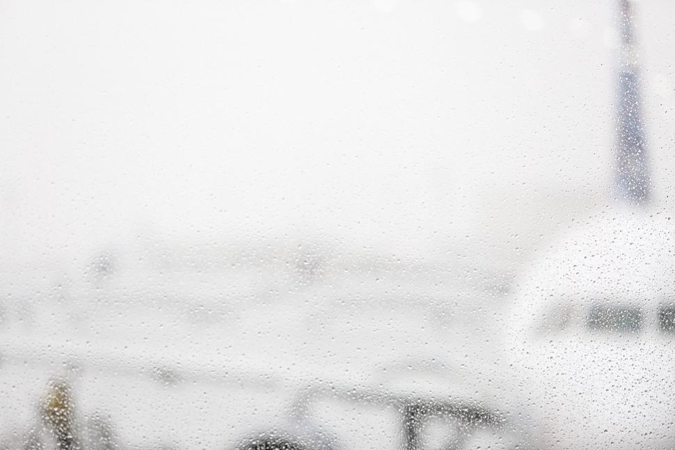 Free Image of Aircraft Taxiing on Runway in Rain 
