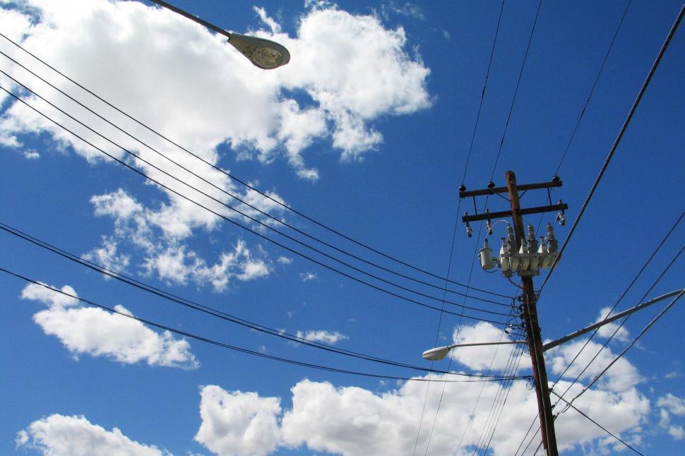 Free Image of Telephone Pole With Street Light Background 