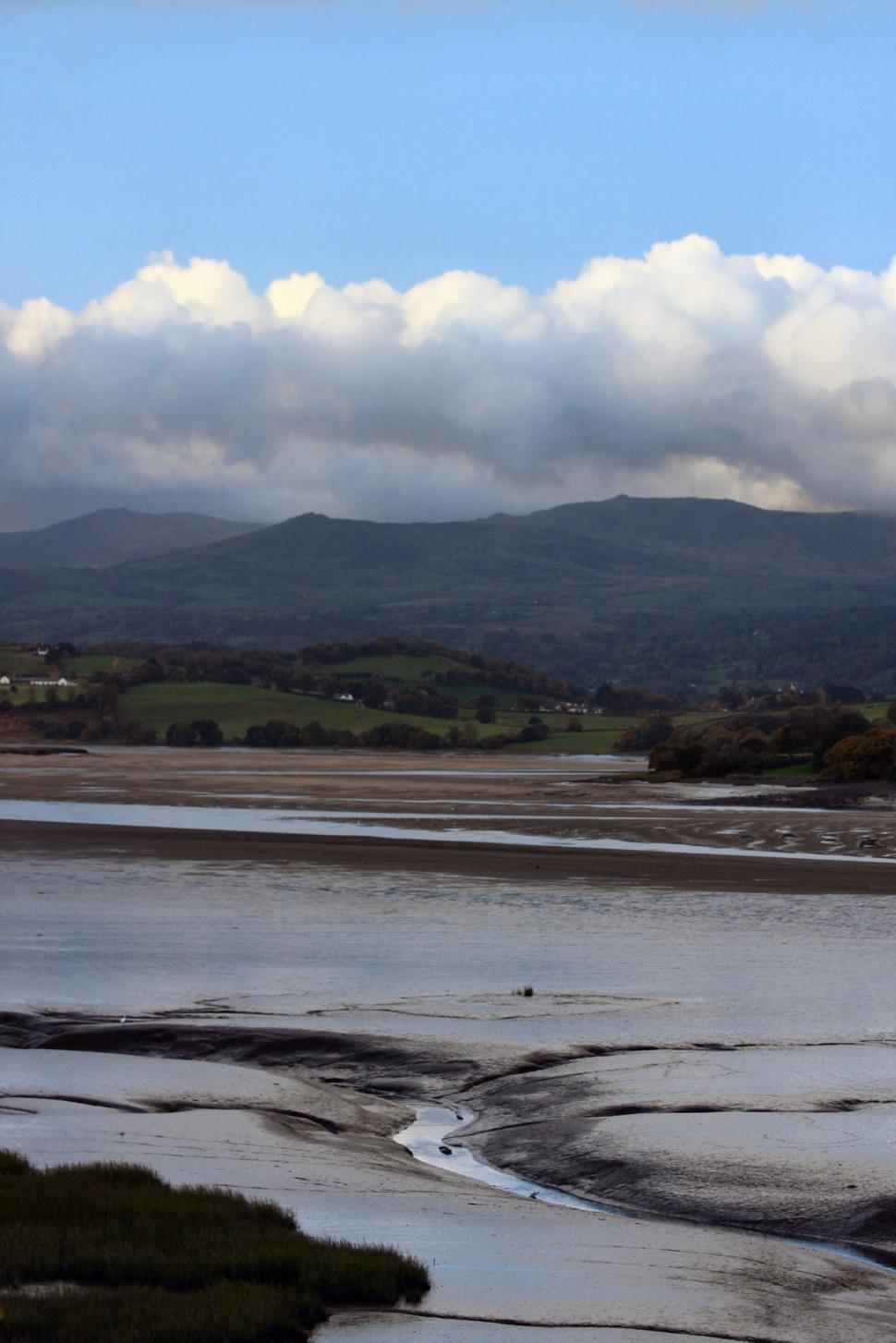 Free Image of Majestic Mountains Overlooking Vast Body of Water 