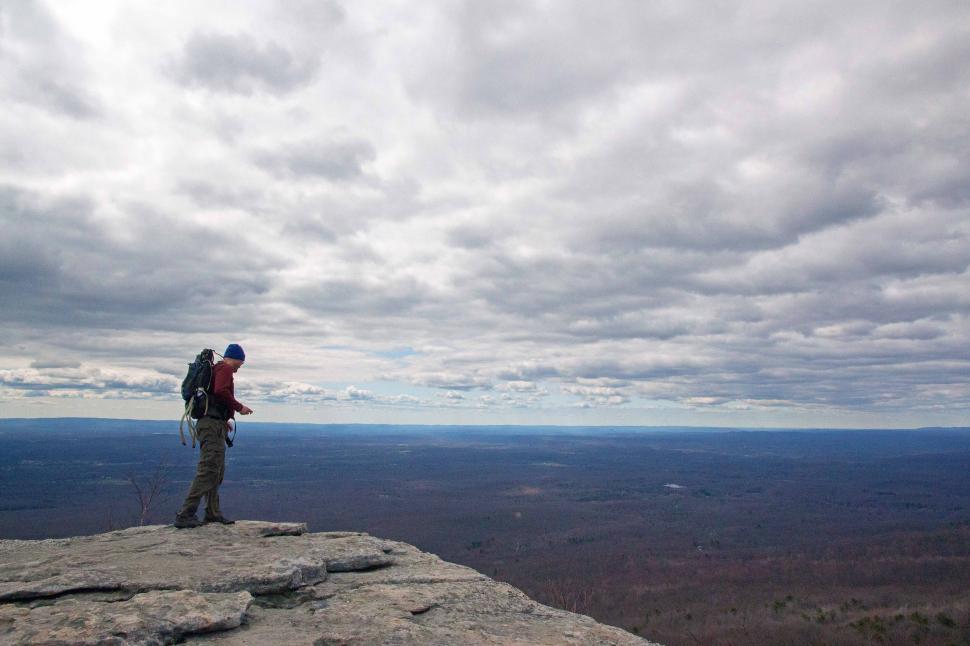 Free Image of Hiker at Sams Point Preserve Enjoying Scenic Vista 