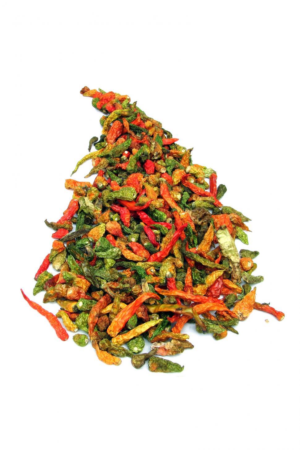 Free Image of Pile of Red and Green Peppers on White Background 