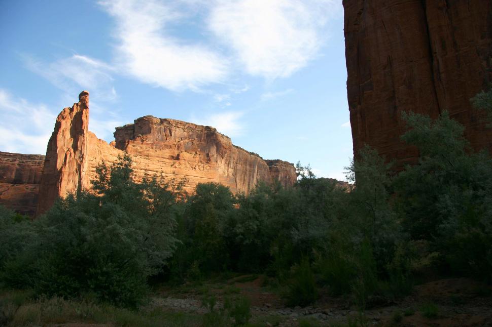 Free Image of Large Rock Formation in Middle of Forest 