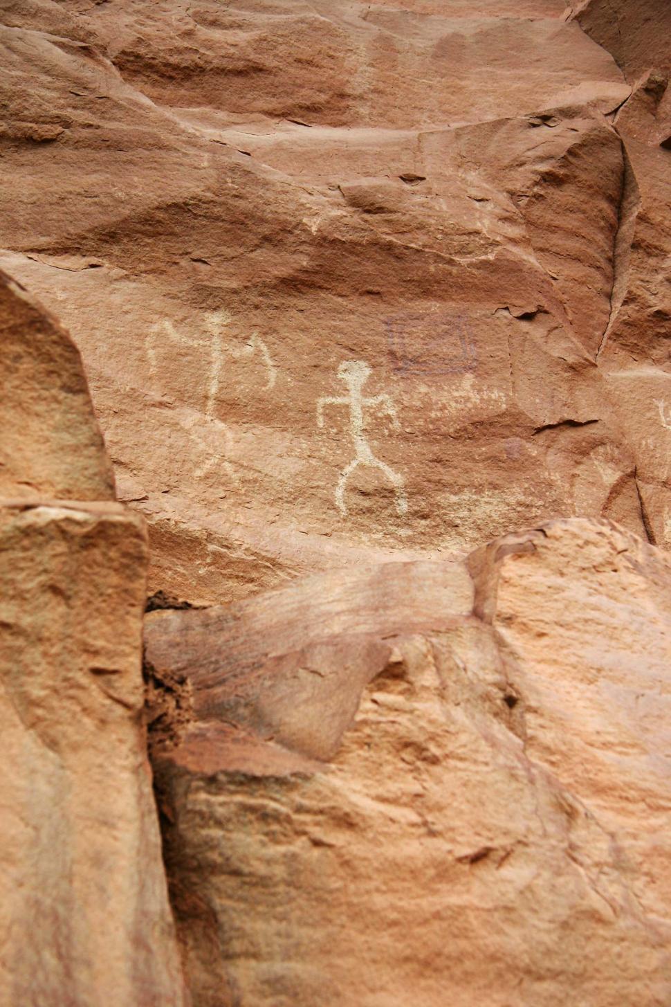 Free Image of Man Climbing Mountain With Surfboard 