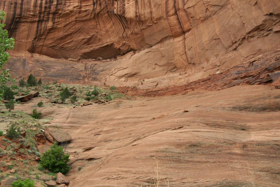 Free Image of Man Riding Horse Through Canyon 