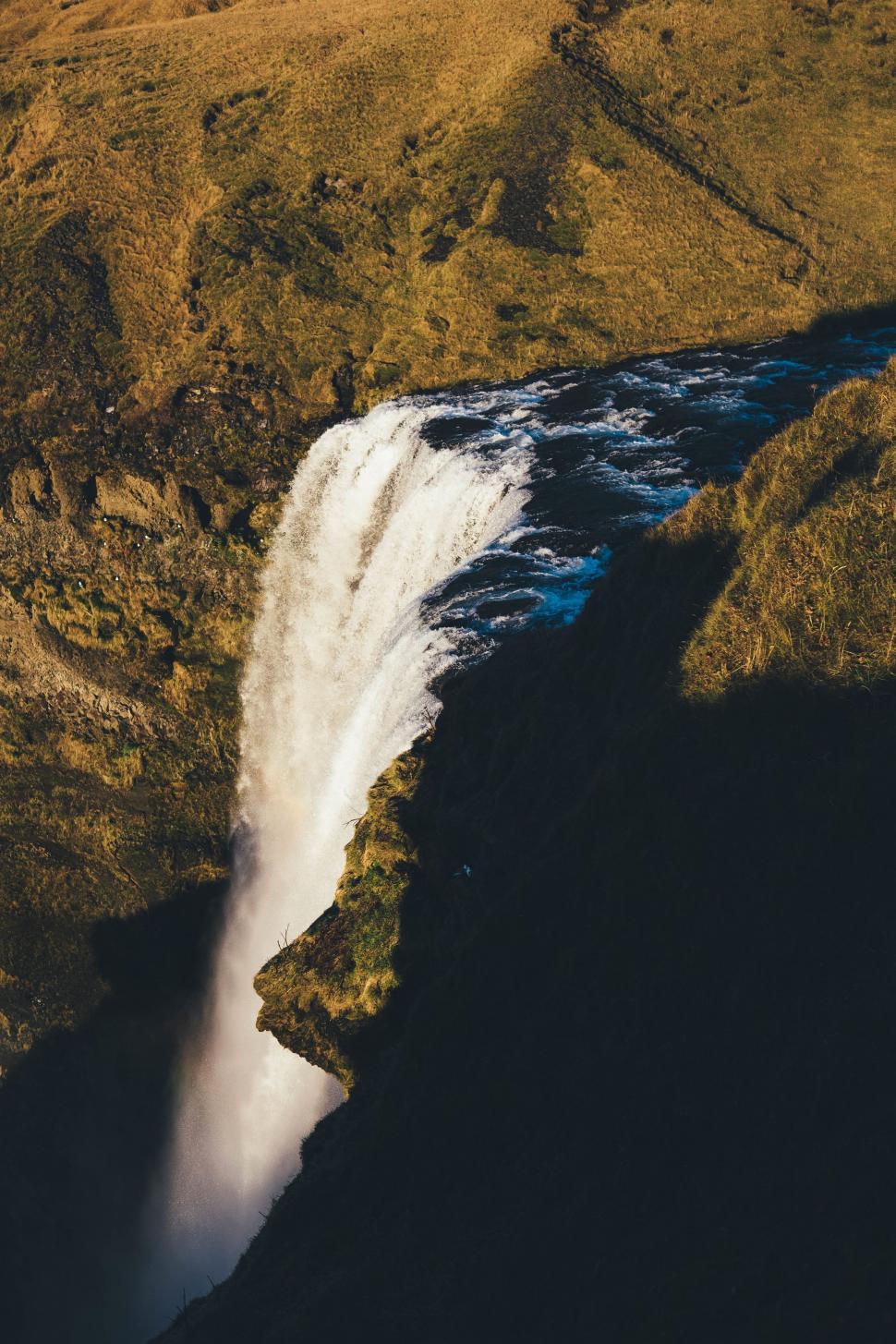 Free Image of Aerial View of a Waterfall in the Mountains 