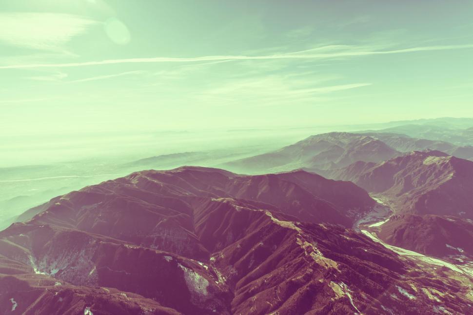 Free Image of A View of a Mountain Range From a Plane 