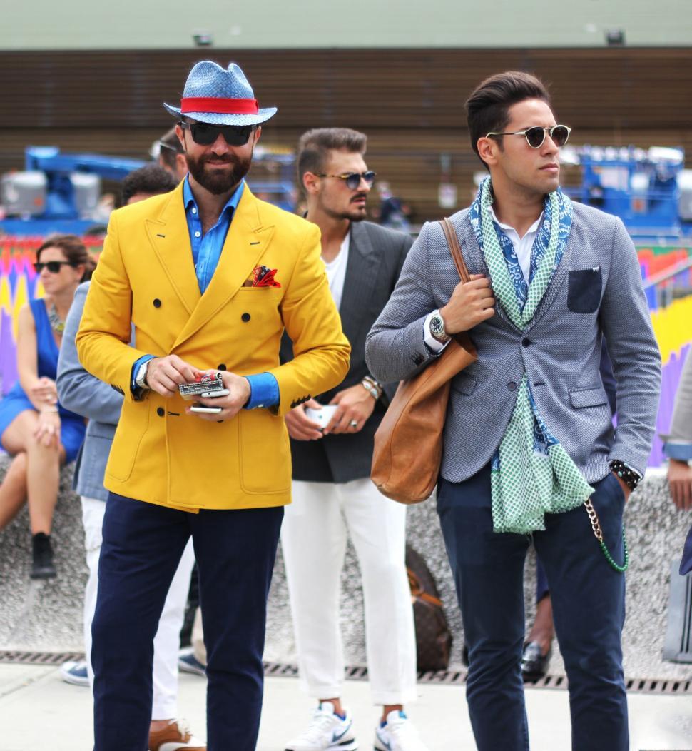 Free Image of Two Men in Suits and Hats Walking Together 