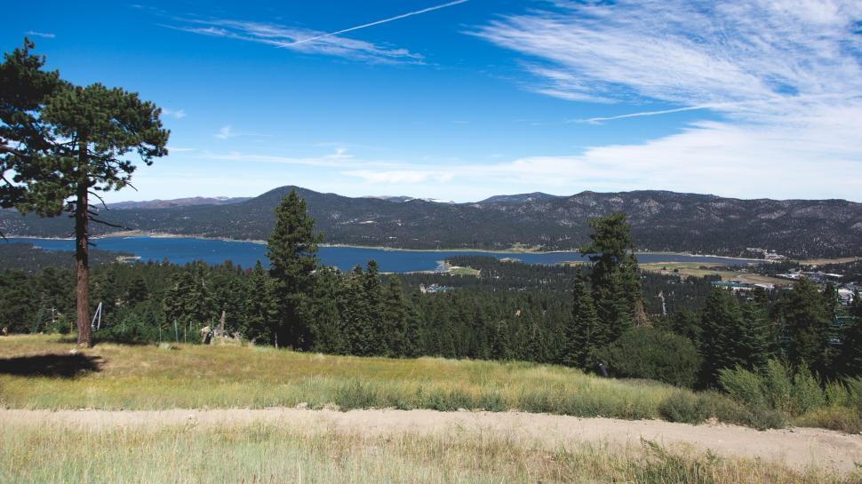 Free Image of A View of a Lake and Mountains From a Hill 