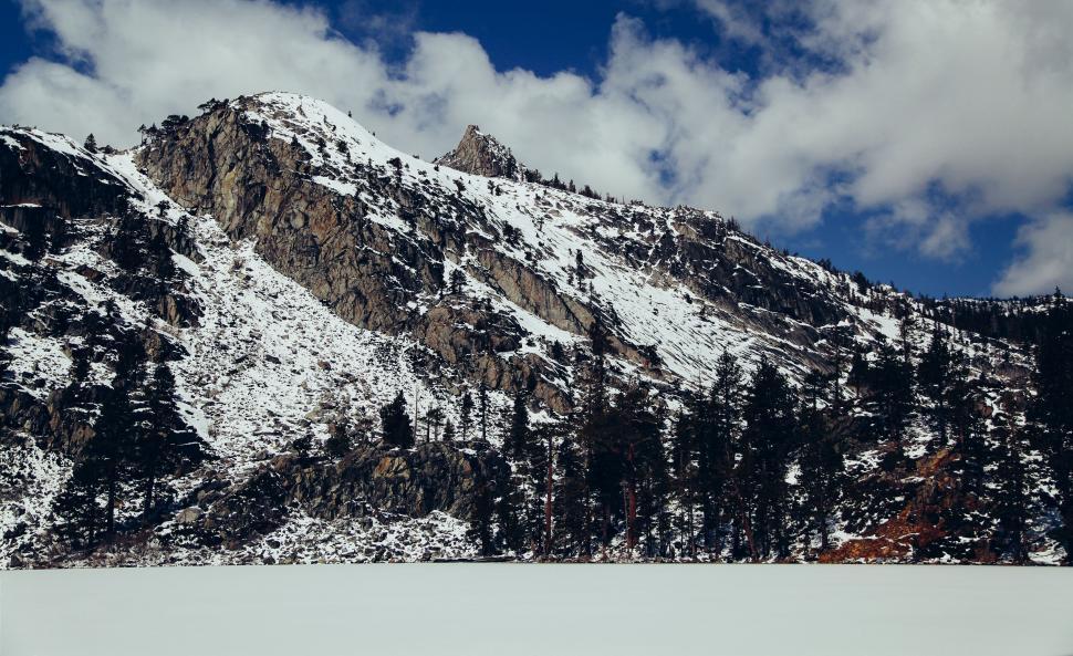 Free Image of Man Skiing Down Snow Covered Slope 