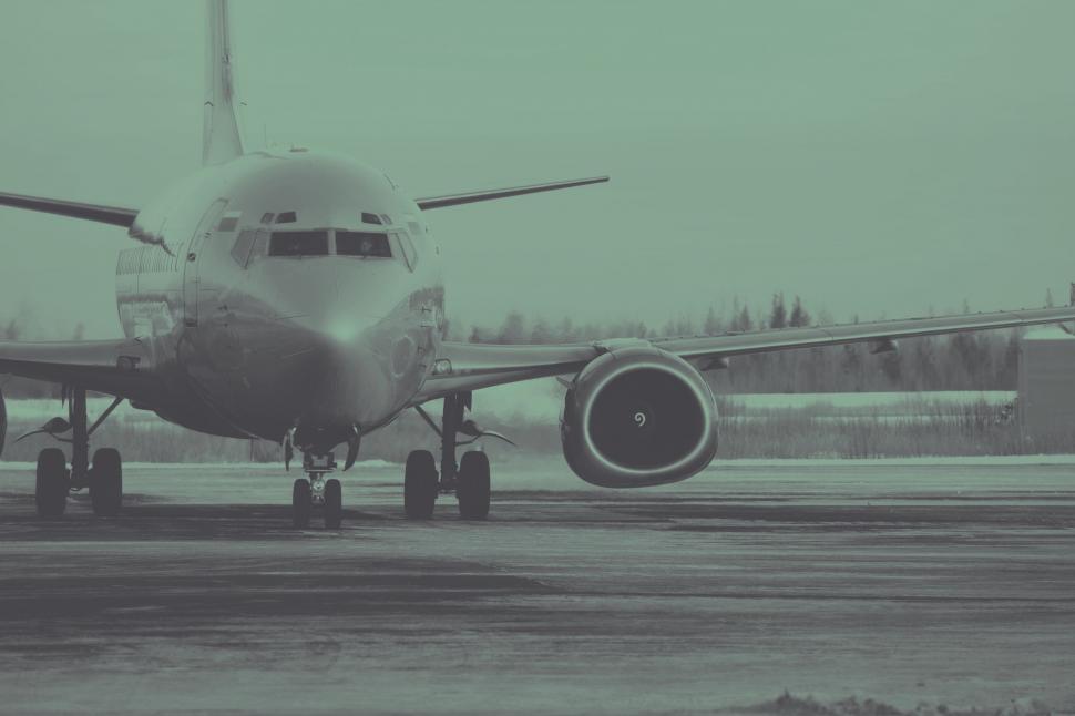 Free Image of Large Jetliner Parked on Airport Runway 