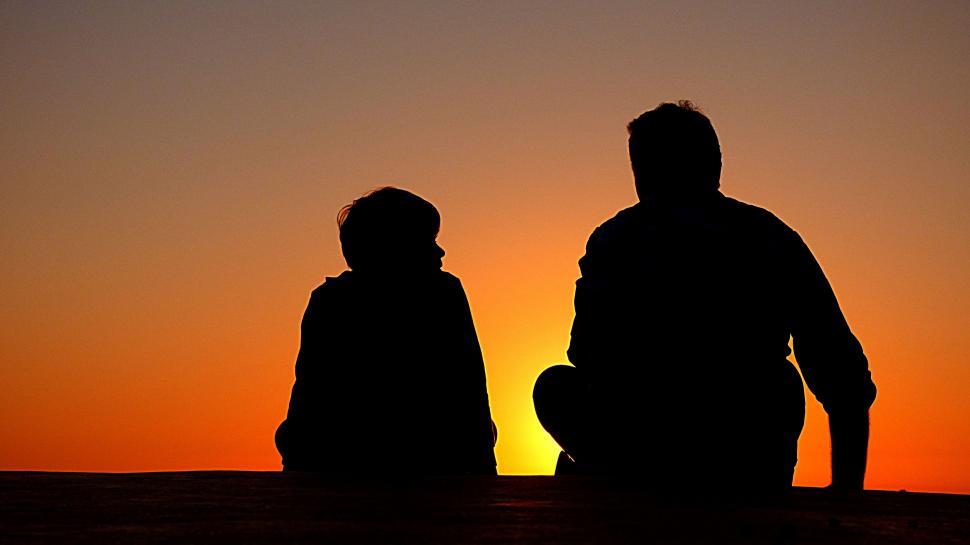 Free Image of Two People Sitting Together 