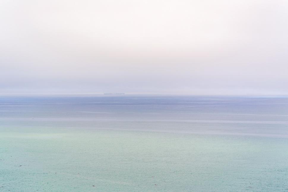 Free Image of Man Riding Surfboard on Top of Ocean Wave 