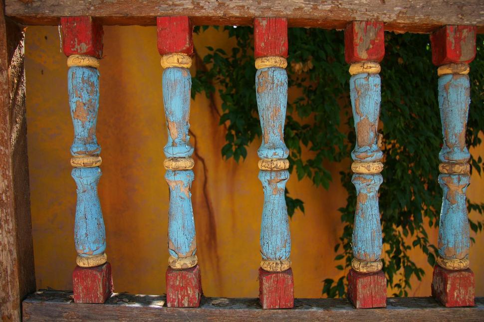 Free Image of Wooden Bench With Plant in Background 