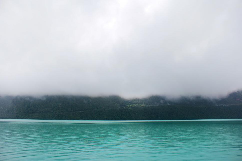 Free Image of Mountain Overlooking Body of Water 