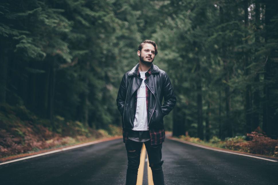 Free Image of Man Standing on Side of Road 