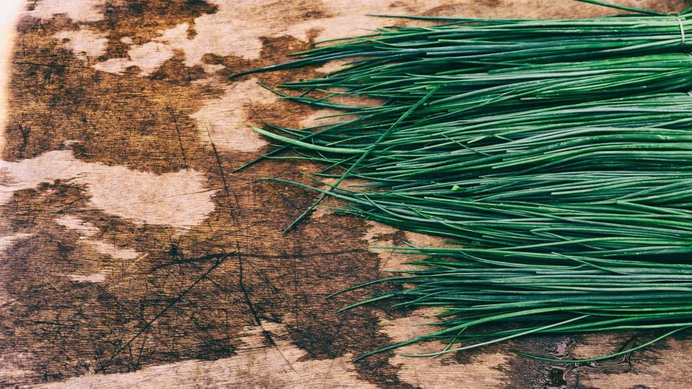 Free Image of Pile of Green Grass on Wooden Table 