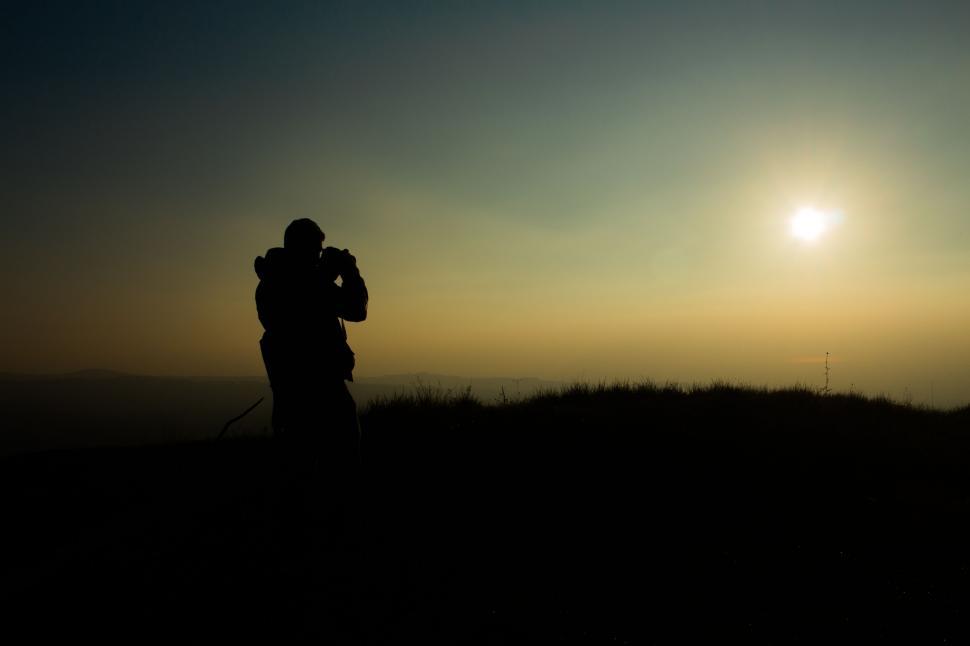 Free Image of Person Taking Picture of Sun 