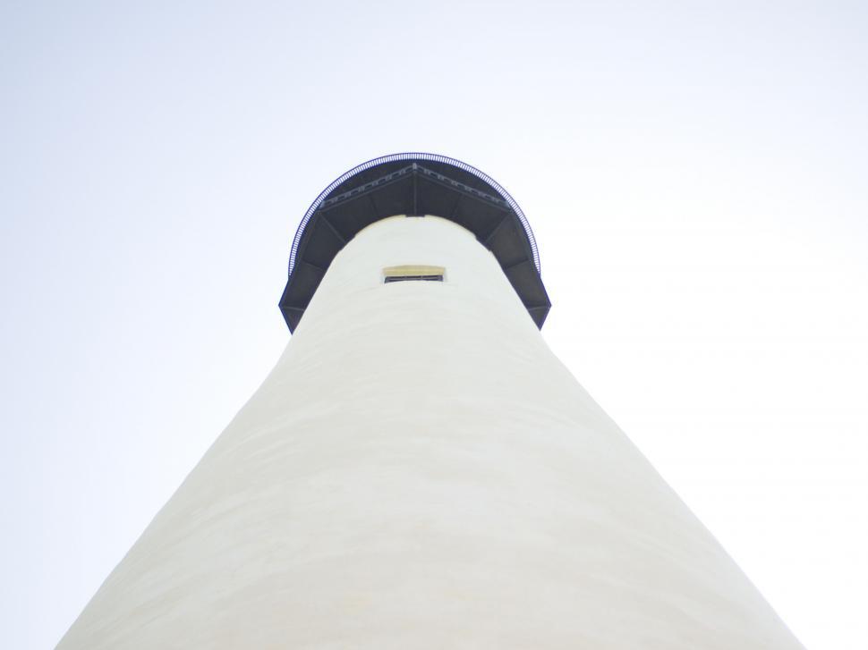 Free Image of White Building With Black Roof Against Sky Background 