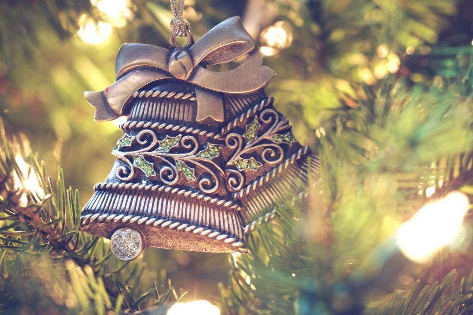 Free Image of Bell Ornament Hanging From Christmas Tree 
