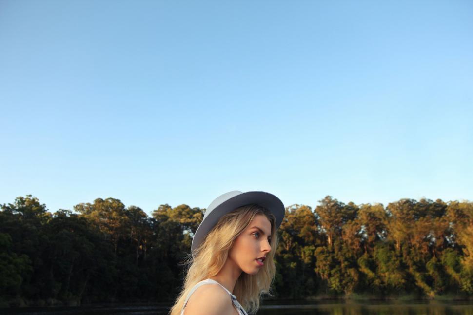 Free Image of Woman Standing by a Body of Water 