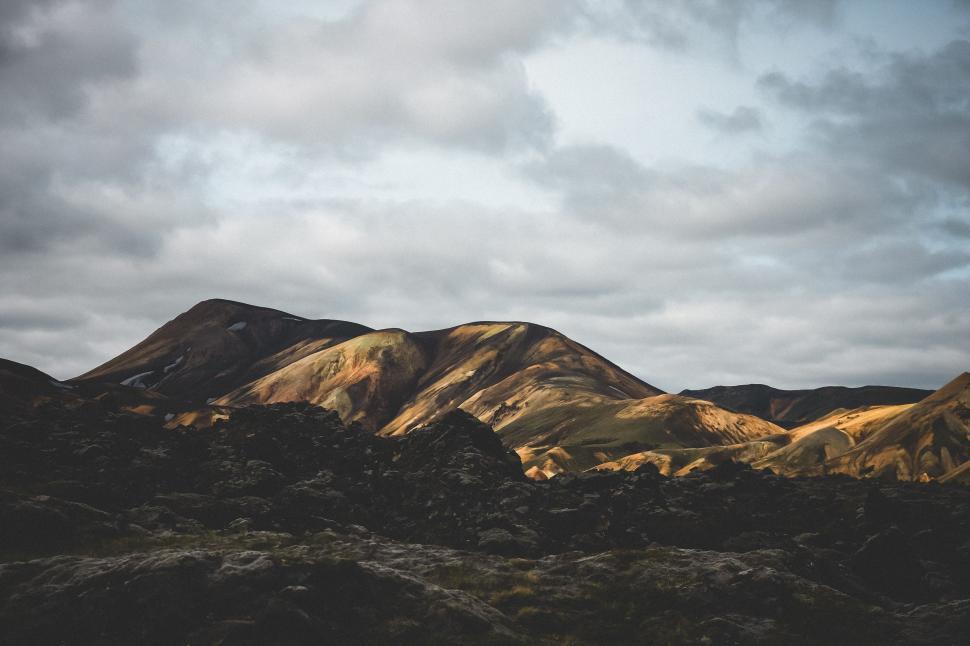 Free Image of Majestic Mountain Range Under Cloudy Sky 