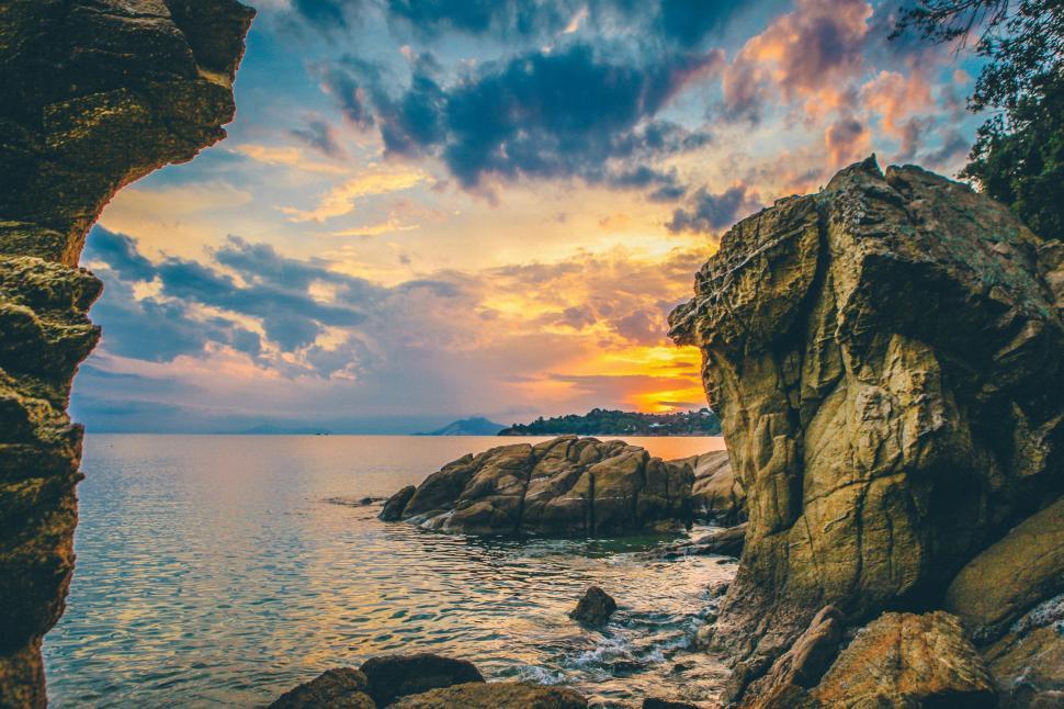 Free Image of A Glimpse of the Ocean From a Rocky Shore 