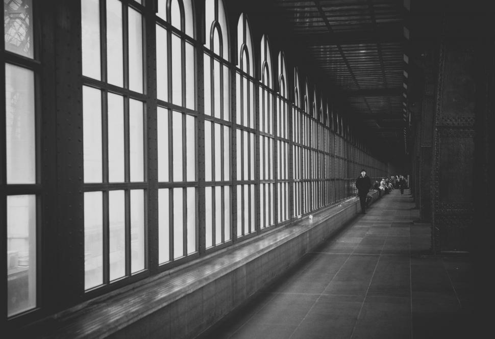 Free Image of People Walking Down a Hallway 