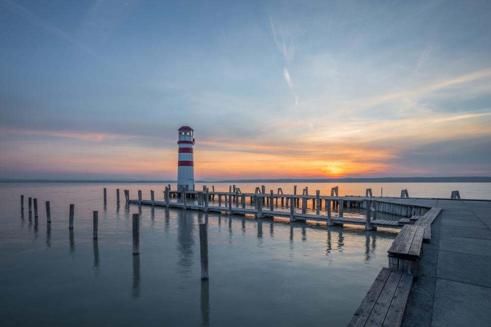 Free Image of Lighthouse on Pier by the Ocean 