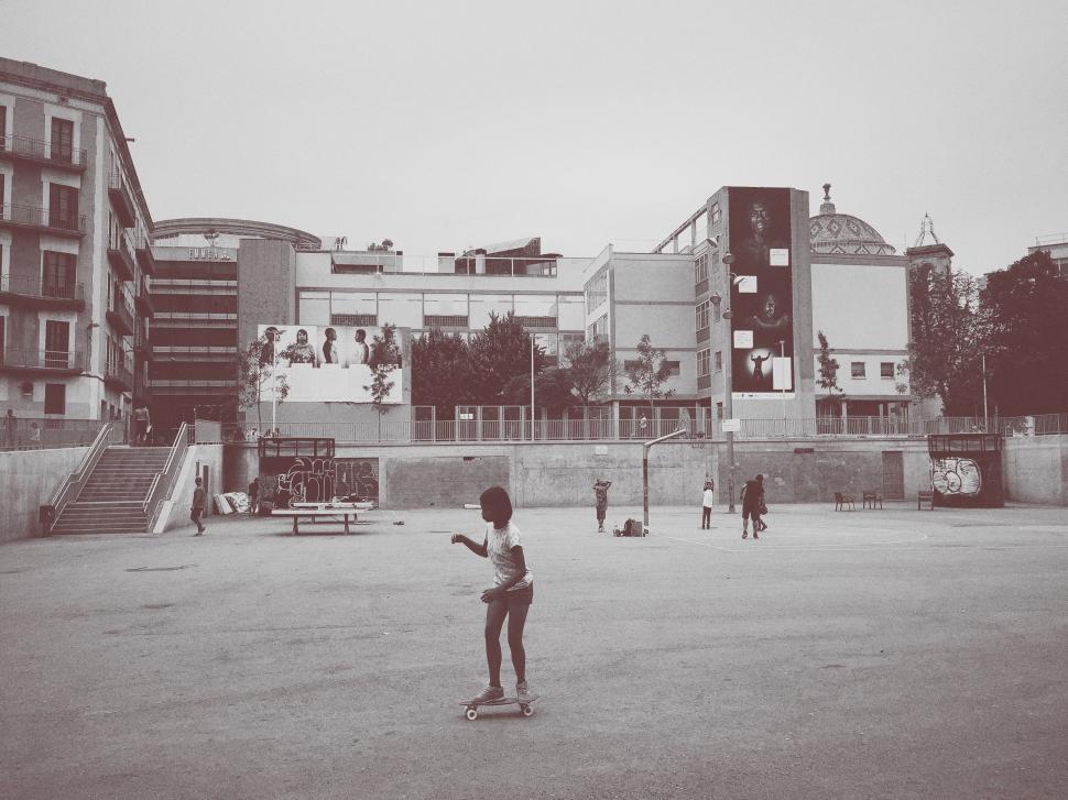 Free Image of Boy Riding Skateboard in Black and White 