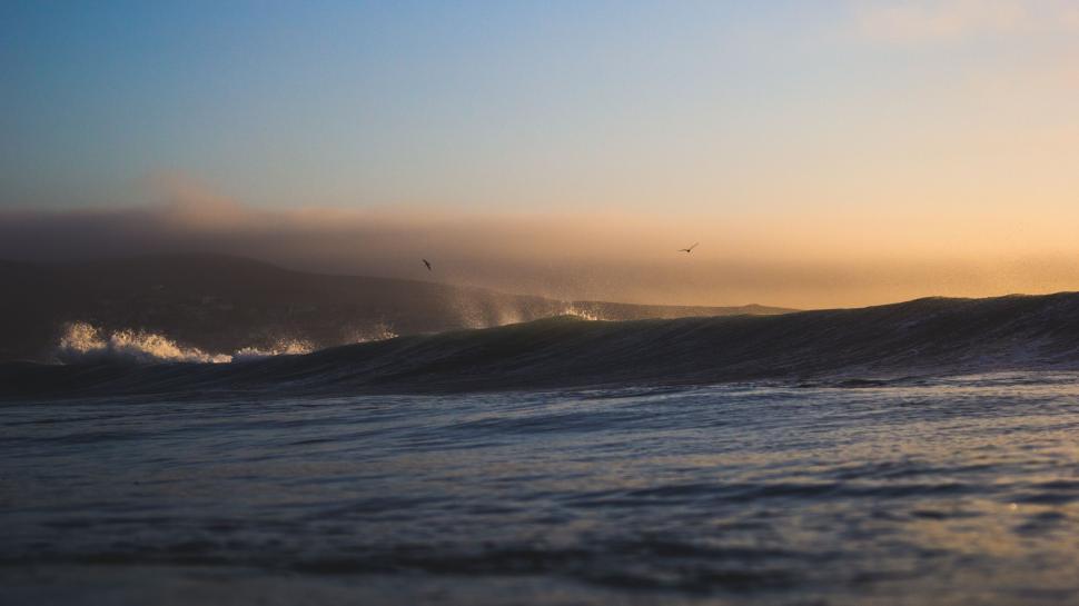 Free Image of Person Riding Surfboard on Wave in Ocean 