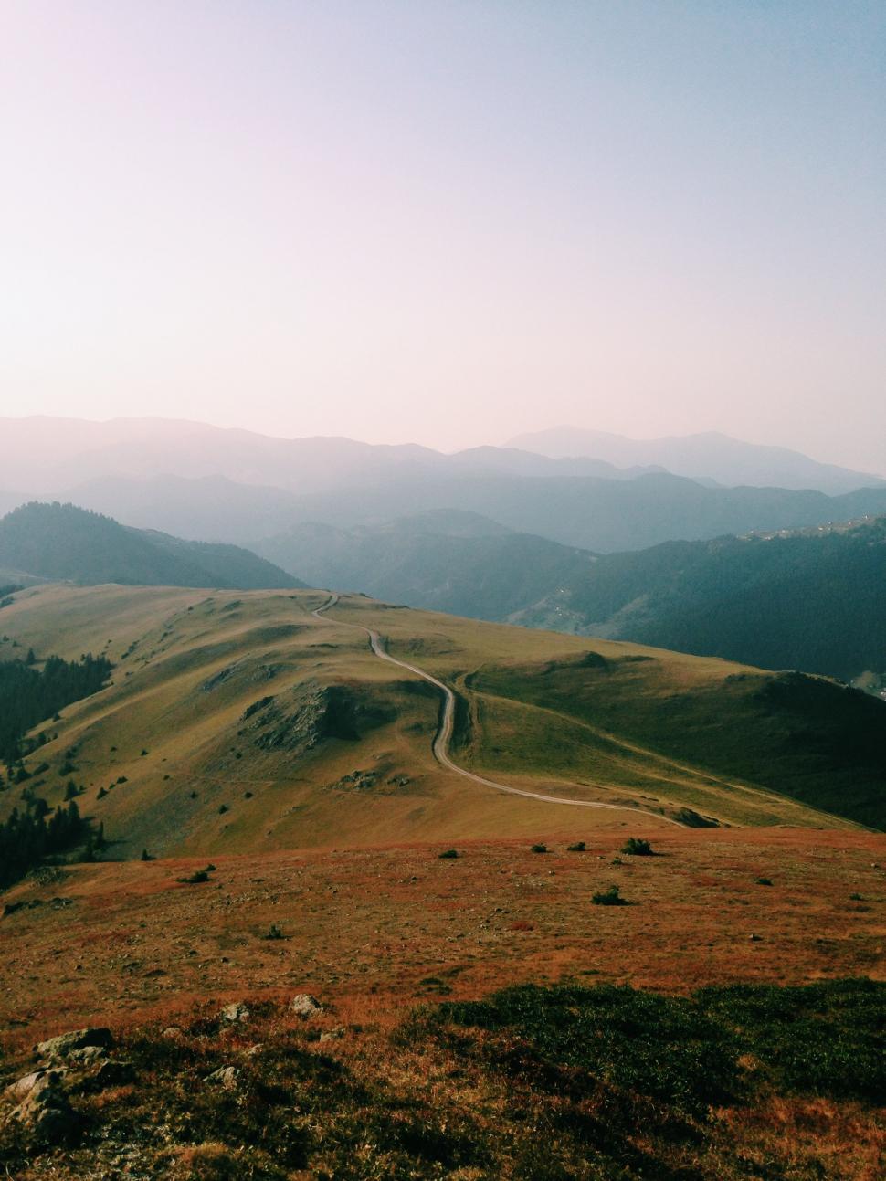Free Image of Road Cutting Through Grassy Hill 