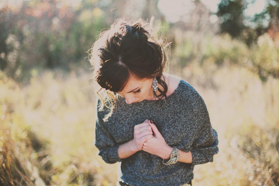 Free Image of Woman Standing in Field of Tall Grass 