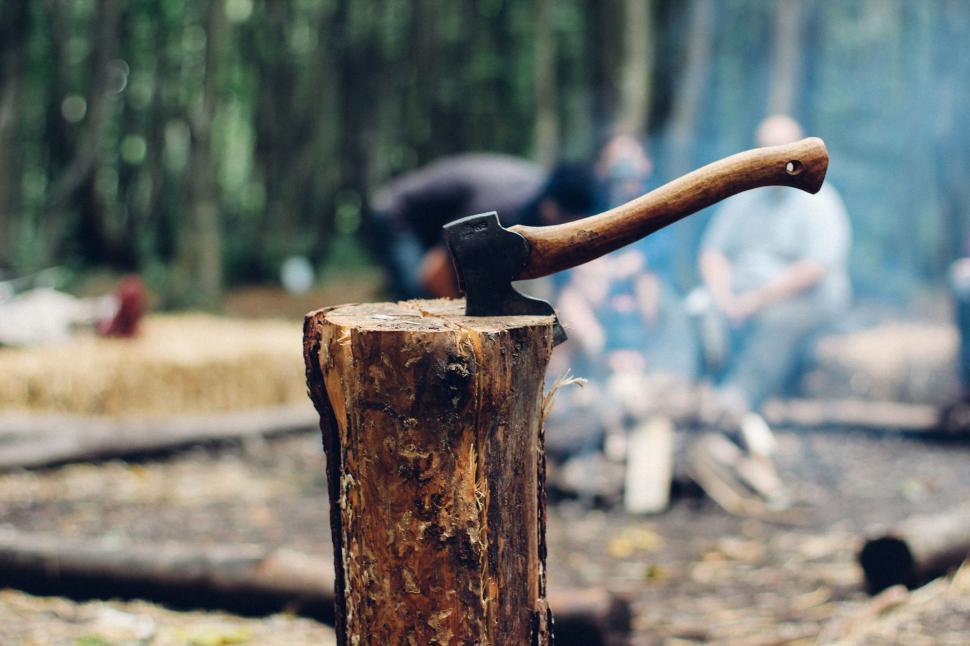 Free Image of Old Axe Embedded in Tree Stump 