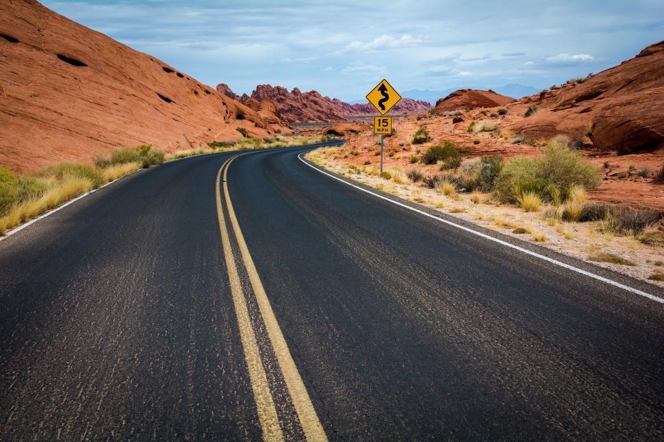 Free Image of Empty Road Cutting Through Desert Landscape 