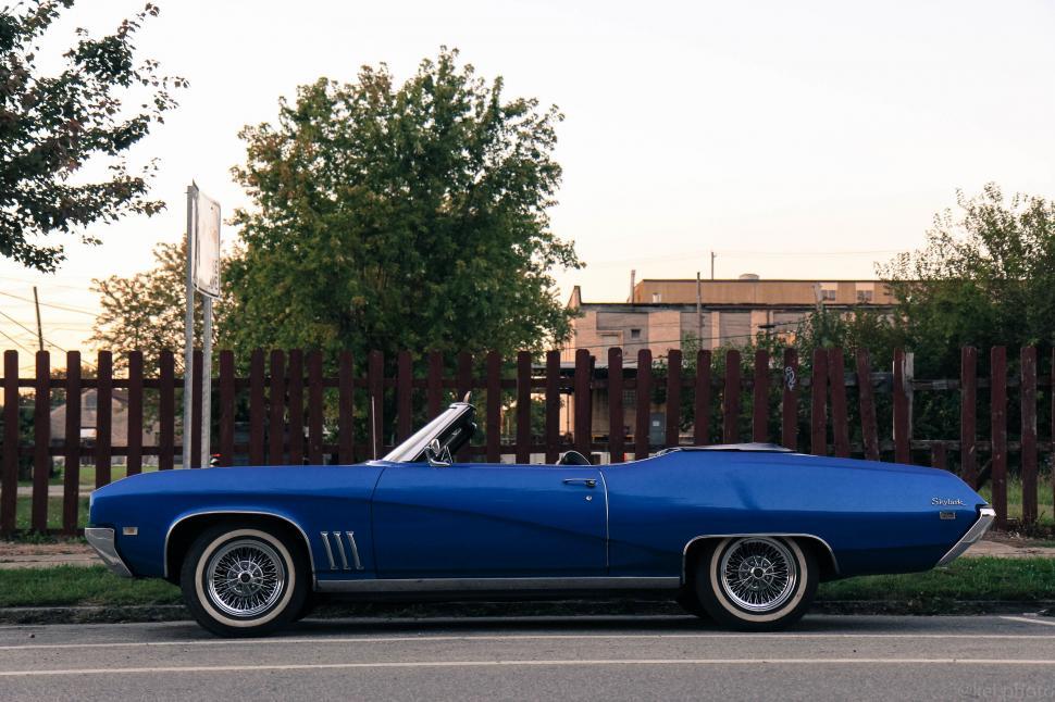 Free Image of Blue Car Parked on Side of Road 