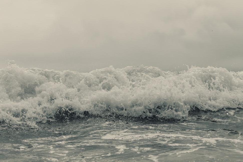 Free Image of Man Riding Wave on Surfboard 