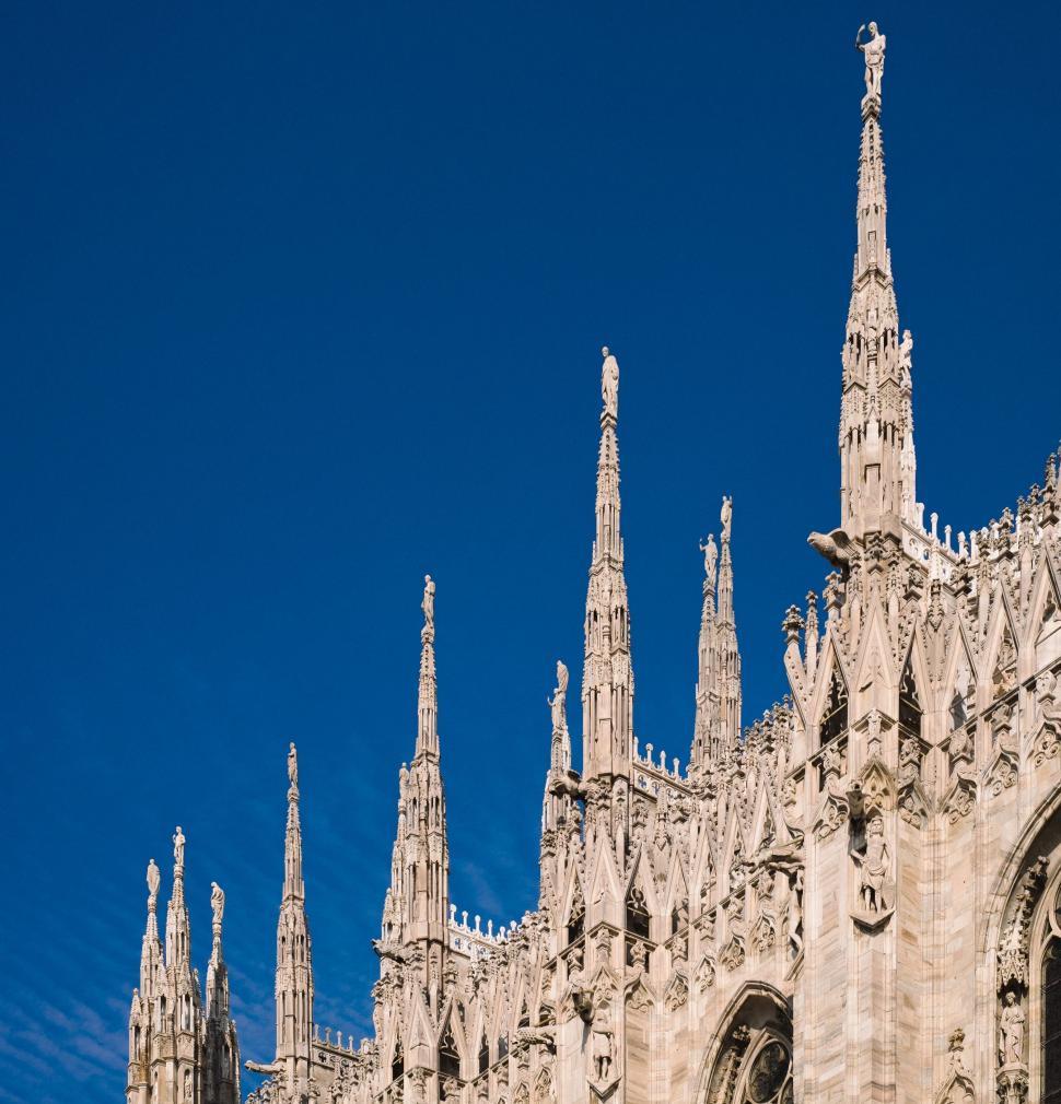 Free Image of Tall Building With Clock on Side 