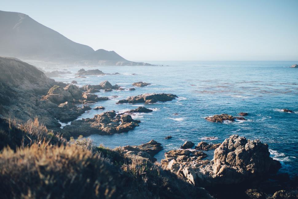 Free Image of Mountain Overlooking Body of Water 