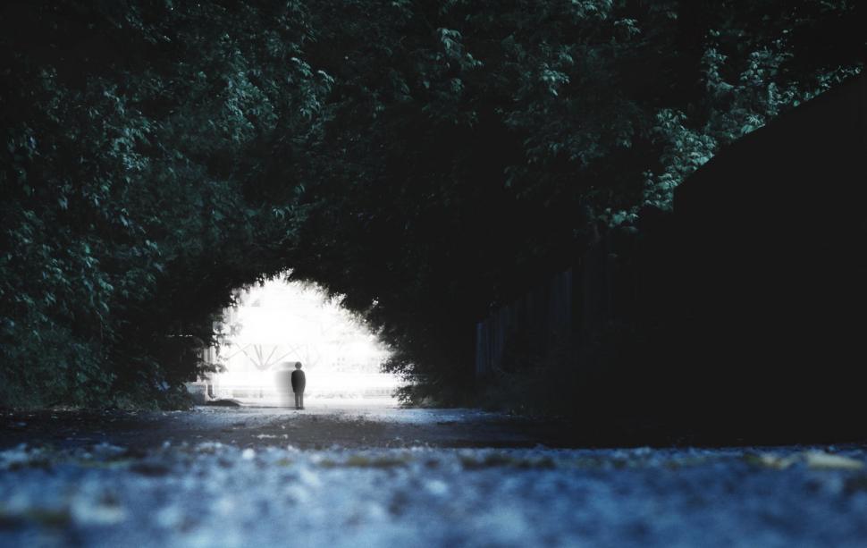 Free Image of Person Standing in Dark Tunnel 