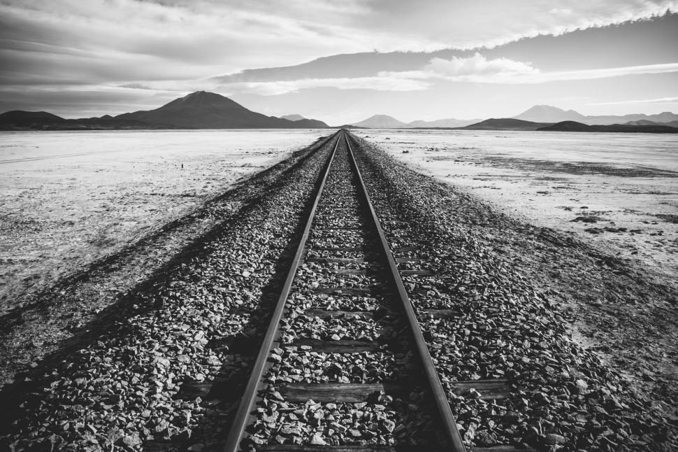 Free Image of A Black and White Photo of a Train Track 