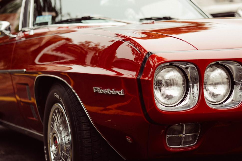 Free Image of Close Up of the Front of a Red Car 