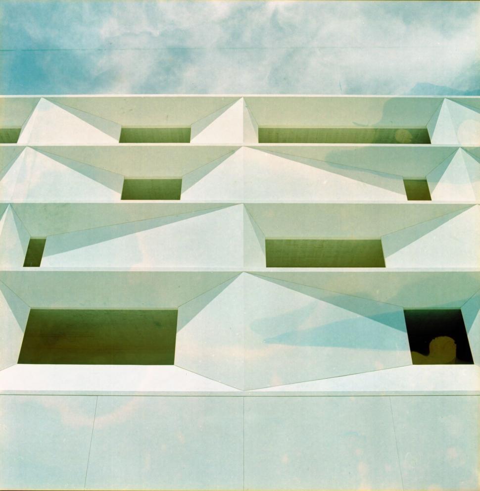 Free Image of White Building With Sky in Background 