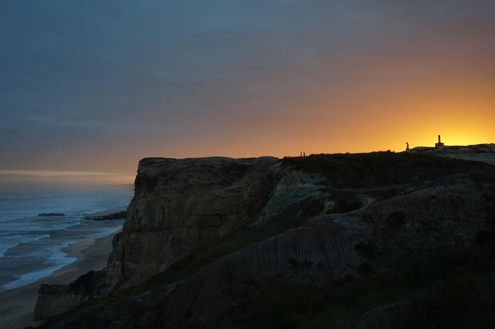 Free Image of Person Standing on Cliff Overlooking Ocean 