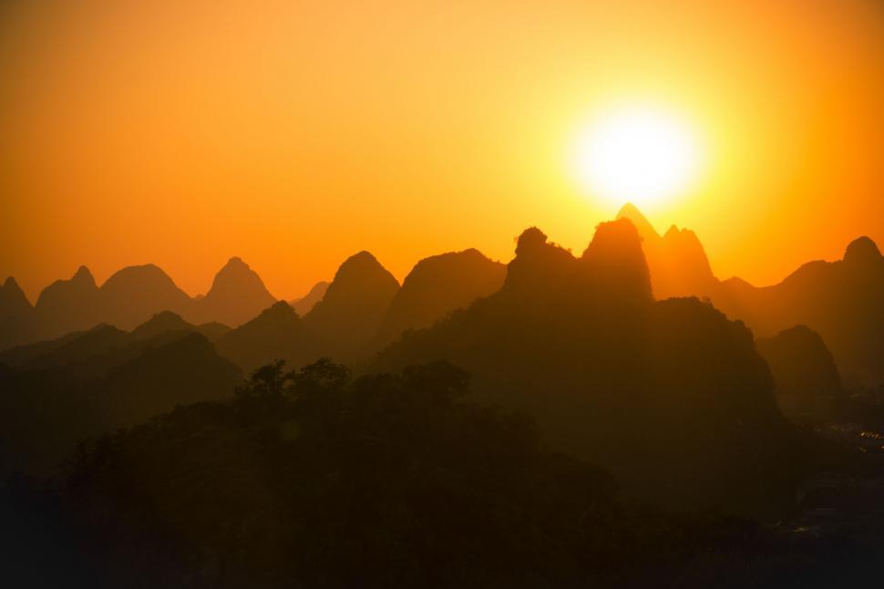 Free Image of Sun Setting Over Mountain Range 