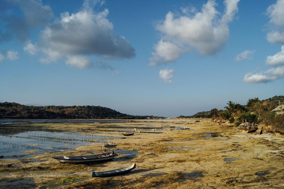 Free Image of Two Boats Docked on Lake Shore 
