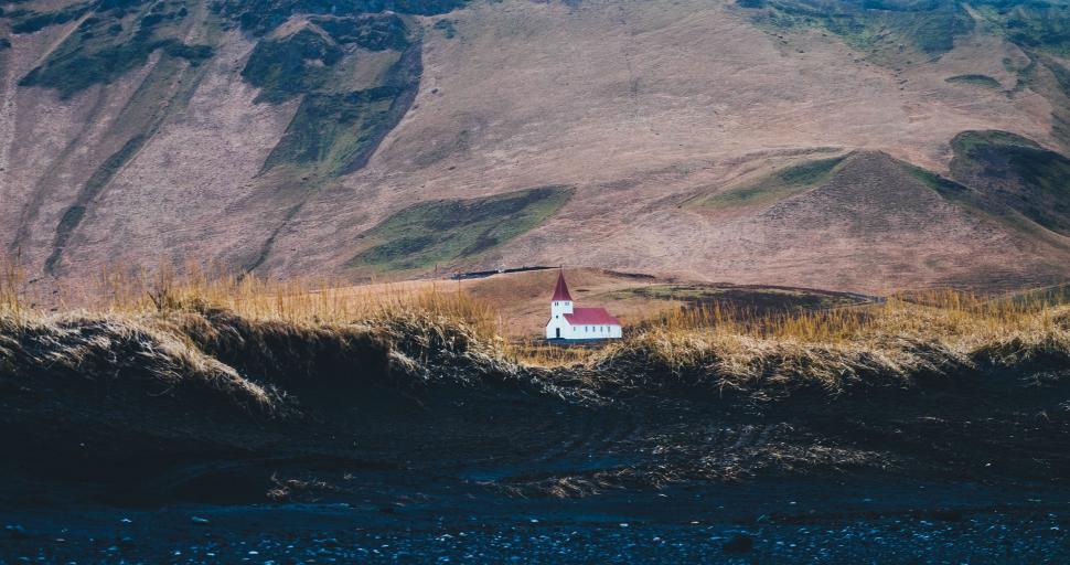 Free Image of Small House in the Middle of a Field 