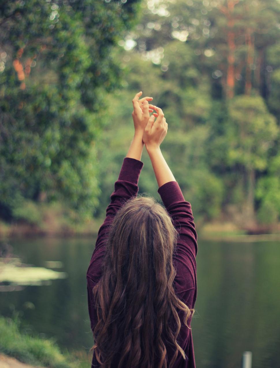 Free Image of Woman Standing by Water 