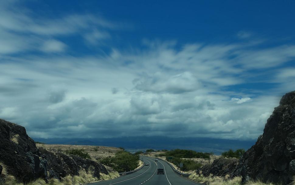 Free Image of Car Driving Down Mountain Road 